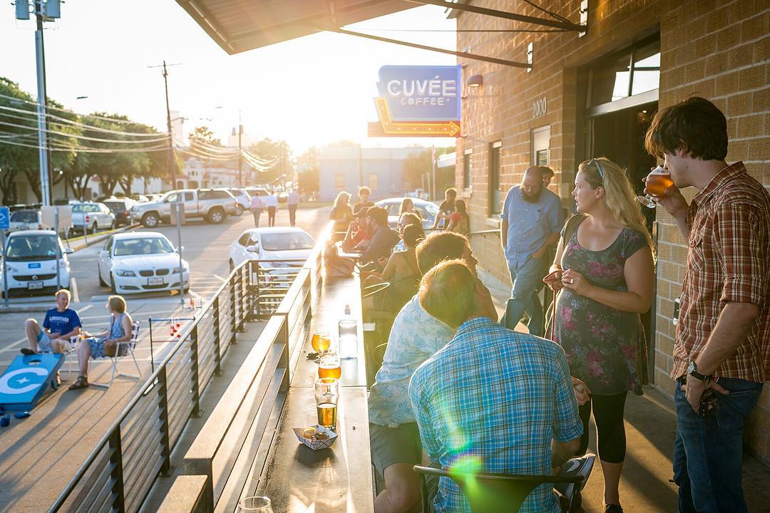 a group of customers on cuvee coffee's patio bar