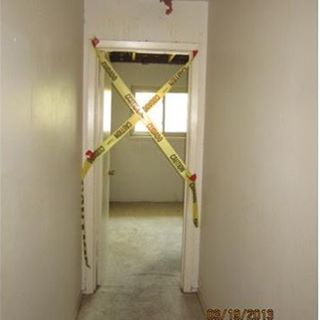 worst mls photos door with caution tape on frame